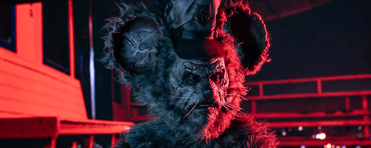 A demonic looking mouse on the deck of a ship lit up with bright red lights