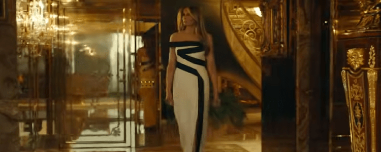 Melania Trump standing in her apartment while wearing an  ugly dress